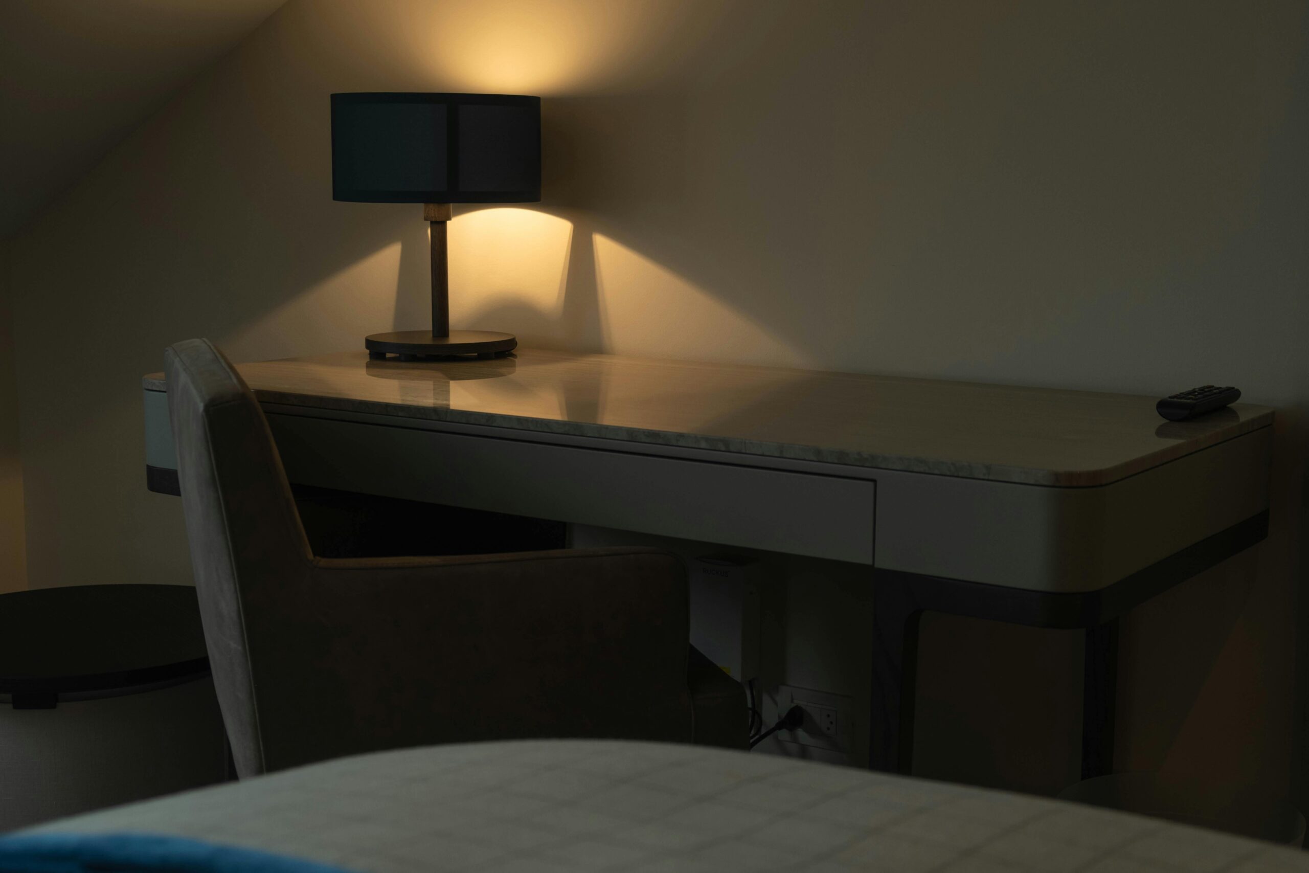 warm table lamp creating soft light in a calm bedroom space