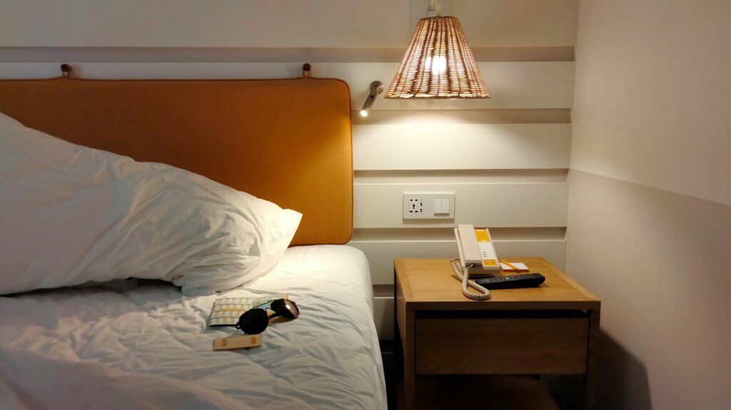 cozy bedroom with warm bedside table lamp lighting